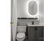 Modern bathroom featuring a vanity, a LED mirror, toilet and sleek fixtures at 6019 Timbertop Ln, Charlotte, NC 28215