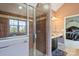 Bathroom featuring a glass shower, a sink and access to a bedroom at 6019 Timbertop Ln, Charlotte, NC 28215