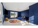 Bonus room featuring blue walls, plush seating, and a flat screen tv at 6019 Timbertop Ln, Charlotte, NC 28215