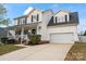 Traditional two-story home with a covered porch and attached two-car garage at 6019 Timbertop Ln, Charlotte, NC 28215