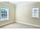 Neutral colored bedroom with carpet and two windows at 735 Amalfi Dr, Davidson, NC 28036