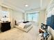 Bright bedroom boasts neutral colors, tray ceiling, and serene views at 735 Amalfi Dr, Davidson, NC 28036