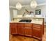 Elegant kitchen island with granite countertops, cooktop, and stylish pendant lighting at 735 Amalfi Dr, Davidson, NC 28036