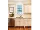 Bright kitchen sink area featuring a window, granite countertops, and stainless steel appliances at 735 Amalfi Dr, Davidson, NC 28036