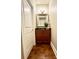 Cozy powder room with a dark wood vanity, mirror, and hardwood floors at 735 Amalfi Dr, Davidson, NC 28036