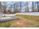 A spacious backyard featuring a white fence and a paved patio area at 10500 Bradstreet Commons Way, Charlotte, NC 28215