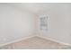 Cozy bedroom with carpet and a window offering plenty of natural light at 10500 Bradstreet Commons Way, Charlotte, NC 28215