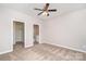 Neutral bedroom with carpet, a ceiling fan, and closet, ready for personalization at 10500 Bradstreet Commons Way, Charlotte, NC 28215