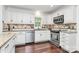 Bright kitchen featuring white cabinets, stainless steel appliances, and granite countertops at 11 Tanglewood Rd, Lake Wylie, SC 29710