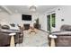 Cozy living room with a fireplace, plush seating, and a sliding glass door to the outdoors at 11 Tanglewood Rd, Lake Wylie, SC 29710