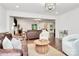 Open concept living area featuring hardwood floors, comfortable seating, and a bright ambiance at 11 Tanglewood Rd, Lake Wylie, SC 29710