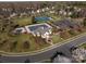 An aerial view of the community clubhouse, pool, tennis courts, and playground in a tranquil setting at 111 Forest Walk Way, Mooresville, NC 28115