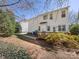 Exterior view of backyard has wooden deck and lush foliage at 111 Forest Walk Way, Mooresville, NC 28115