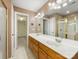 Bathroom featuring double sink vanity, tile flooring, and separate glass shower with soaking tub at 111 Forest Walk Way, Mooresville, NC 28115