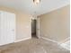 Bedroom featuring carpet flooring and neutral walls, adjoining to a hallway at 111 Forest Walk Way, Mooresville, NC 28115