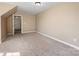 Large bedroom with neutral carpet and attached hallway entrance at 111 Forest Walk Way, Mooresville, NC 28115