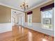 Bright dining room with hardwood floors and views of the front yard at 111 Forest Walk Way, Mooresville, NC 28115