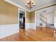 Open dining area showcasing hardwood floors and a glimpse of the kitchen at 111 Forest Walk Way, Mooresville, NC 28115