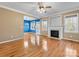 Cozy living room with hardwood floors, fireplace, and ample natural light at 111 Forest Walk Way, Mooresville, NC 28115