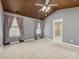 Spacious main bedroom with vaulted ceiling, ceiling fan, and ensuite bath with double windows at 111 Forest Walk Way, Mooresville, NC 28115