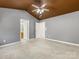 Spacious main bedroom with vaulted ceiling, fan, ensuite, gray walls, and carpet floor at 111 Forest Walk Way, Mooresville, NC 28115