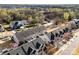 Aerial view of neighborhood featuring townhomes and mature trees at 12124 Red Rust Ln, Charlotte, NC 28277