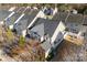 Aerial view of home showcasing roof, landscaping, and neighborhood at 12124 Red Rust Ln, Charlotte, NC 28277