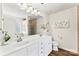 Bathroom with double sink vanity, large mirror and a walk-in shower at 12124 Red Rust Ln, Charlotte, NC 28277