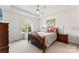 Inviting bedroom with trey ceiling, ceiling fan, and natural light at 12124 Red Rust Ln, Charlotte, NC 28277