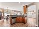 Kitchen with stainless steel appliances, breakfast bar, wood cabinets, and open floorplan at 12124 Red Rust Ln, Charlotte, NC 28277