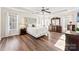 Spacious main bedroom with a tray ceiling, hardwood floors, and plenty of natural light at 12124 Red Rust Ln, Charlotte, NC 28277