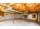 Unfinished basement with exposed ceiling beams, concrete walls, and a ladder at 126 Regal Cir # 2122, Mooresville, NC 28115