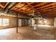 Unfinished basement features concrete floors, exposed duct work, and cinder block walls, offering potential for customization at 126 Regal Cir # 2122, Mooresville, NC 28115