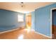 Comfortable bedroom with light-blue walls, a closet, and hardwood floors at 126 Regal Cir # 2122, Mooresville, NC 28115