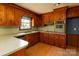 Functional kitchen with plentiful wood cabinetry, modern appliances, and ample counter space at 126 Regal Cir # 2122, Mooresville, NC 28115