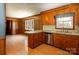 Well-lit kitchen with wood cabinets, offering space for culinary creativity and dining at 126 Regal Cir # 2122, Mooresville, NC 28115