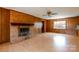 Spacious living room with a brick fireplace and traditional wood paneling at 126 Regal Cir # 2122, Mooresville, NC 28115