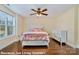 Cozy bedroom with hardwood floors and a ceiling fan offers comfort and style, enhanced by natural light at 1316 Valhalla Dr, Denver, NC 28037