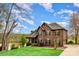 Charming two-story brick home with manicured lawn and mature trees at 1316 Valhalla Dr, Denver, NC 28037