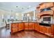 A beautifully designed kitchen featuring wood cabinets, granite countertops, and a backsplash at 1316 Valhalla Dr, Denver, NC 28037