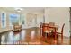Open-concept living area with hardwood floors and natural light showcases a welcoming and versatile living space at 1316 Valhalla Dr, Denver, NC 28037
