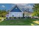 Charming single-Gathering home featuring a craftsman style, well-manicured lawn, and inviting curb appeal at 1512 Brooksland Pl, Waxhaw, NC 28173