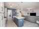 Open-concept kitchen features a center island with seating, stainless steel appliances, and seamless integration with living spaces at 1512 Brooksland Pl, Waxhaw, NC 28173