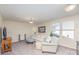 Living room with sofa, side chair, end tables, and TV at 1512 Brooksland Pl, Waxhaw, NC 28173