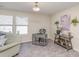 Living room with side chair, end tables, desk, lamp, artwork, and window at 1512 Brooksland Pl, Waxhaw, NC 28173