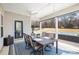 Covered patio with outdoor dining set, ceiling fan, and an adjacent hot tub in view at 1512 Brooksland Pl, Waxhaw, NC 28173