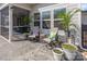 Back porch featuring seating, plants, and a ceiling fan at 1512 Brooksland Pl, Waxhaw, NC 28173