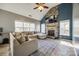 Bright living room featuring a stone fireplace, vaulted ceilings, neutral walls, and a comfortable sectional sofa at 155 Gray Cliff Dr, Mooresville, NC 28117