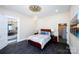 Well-lit bedroom with a bed and decorative ceiling medallion at 1615 Stack Rd, Monroe, NC 28112