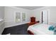 Bedroom with natural light, a classic wooden bed, and wood-look floors at 1615 Stack Rd, Monroe, NC 28112